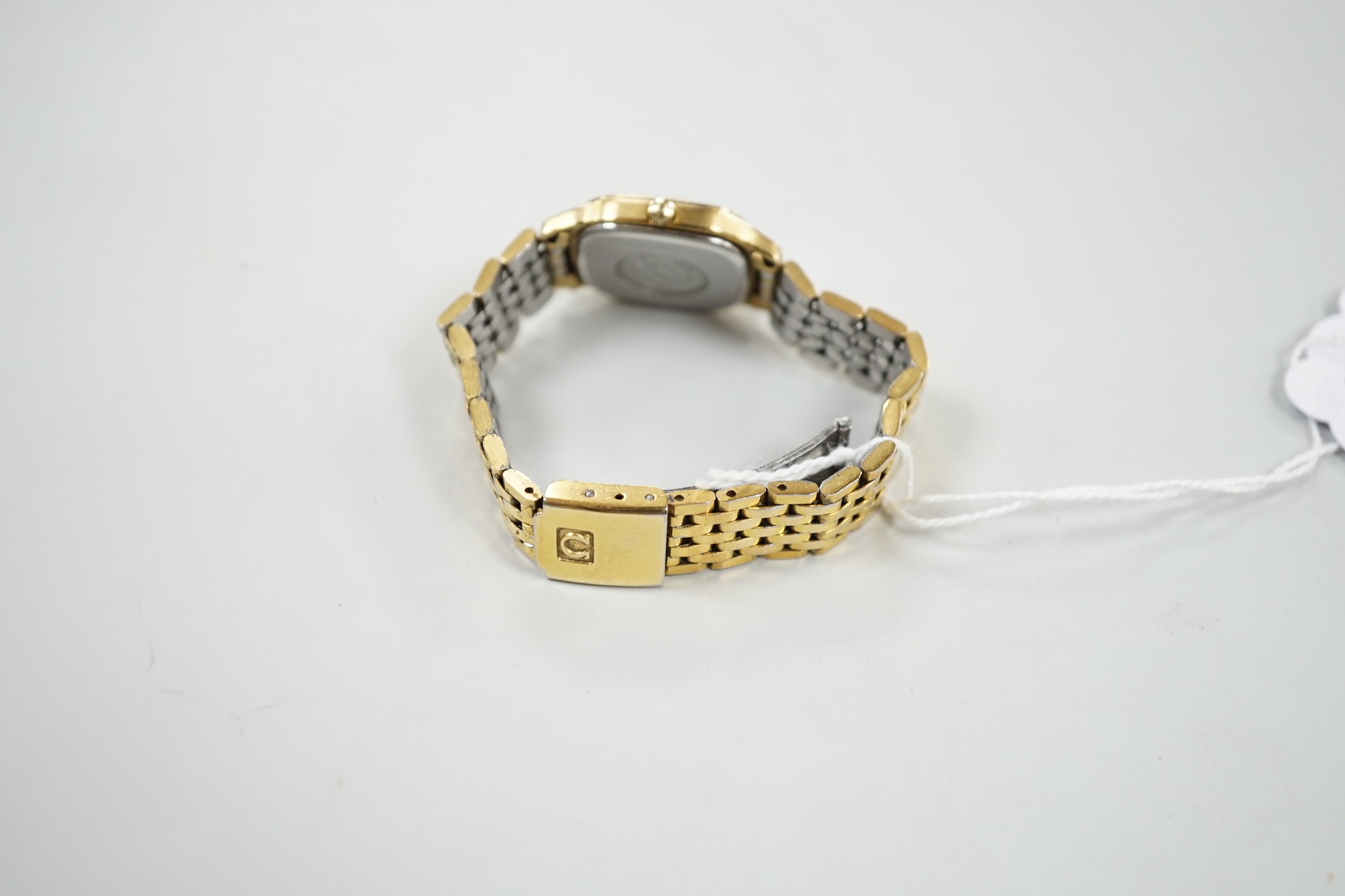 A lady's steel and gold plated Omega Seamaster quartz wrist watch, on an Omega steel and gold plated bracelet.